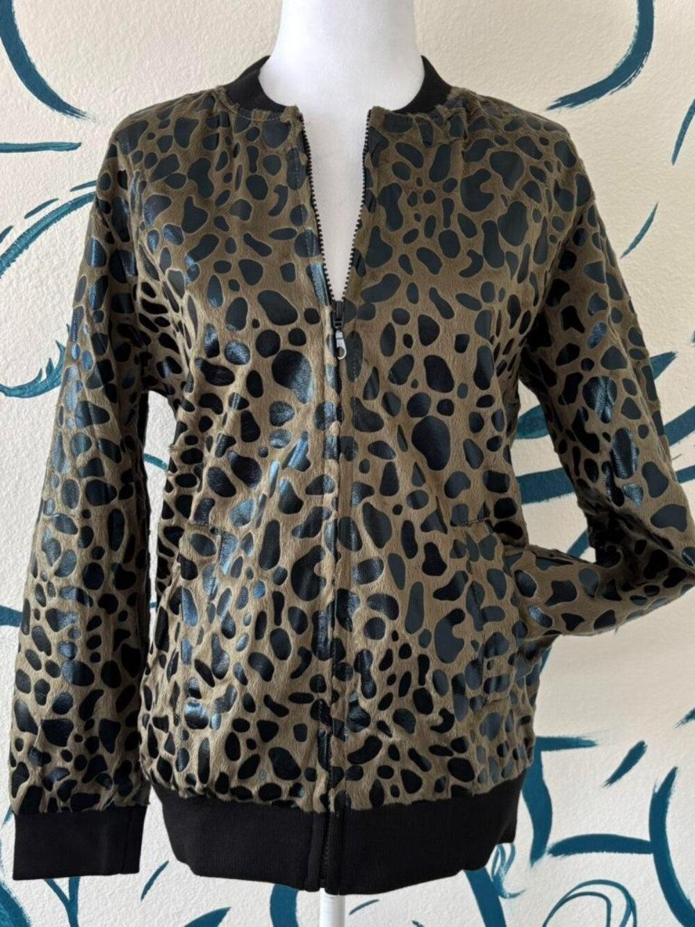 Brown and black cheetah print zip-up jacket with short hair fur